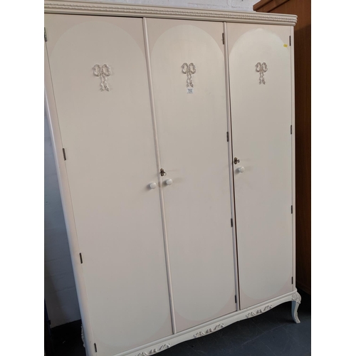 703 - A triple door painted wardrobe