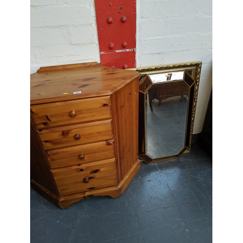 707 - A pine chest of drawers and two mirrors