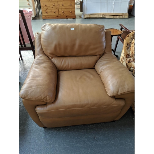 732 - A brown leather chair