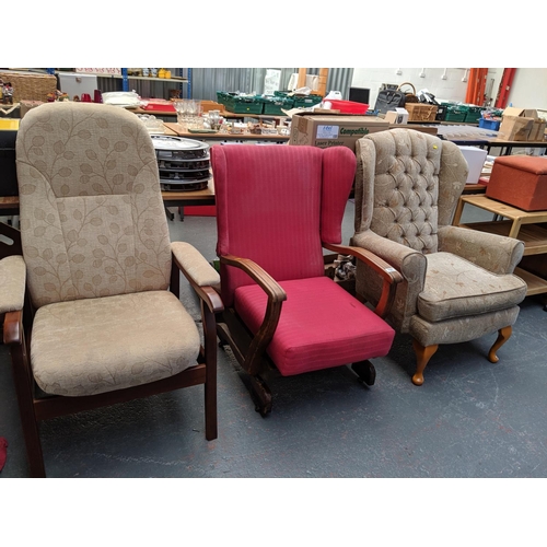 757 - A wingback rocking chair, armchair and another wingback chair