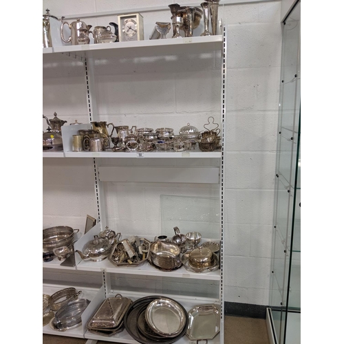 50 - Four shelves of mixed silver plated items