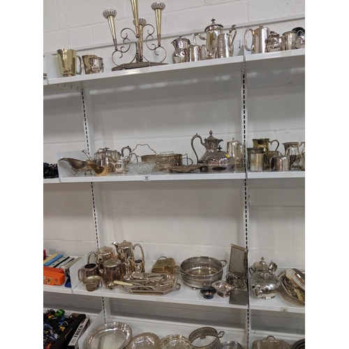 51 - Four shelves of mixed silver plated items