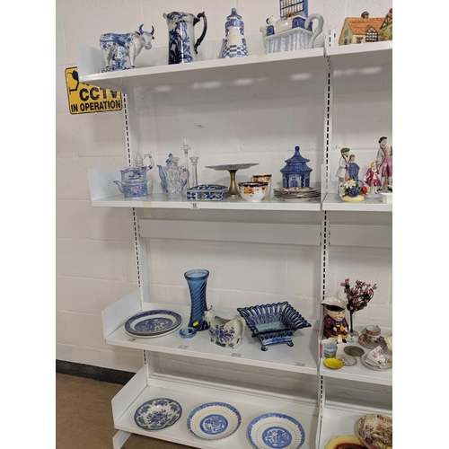 55 - Four shelves of mixed glass and china including Woodware etc.