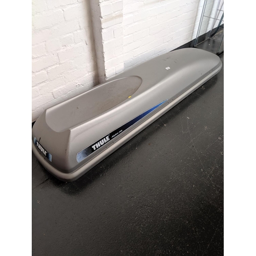 768 - A thule apline 500 roof box with instruction manual, fixings and key in office