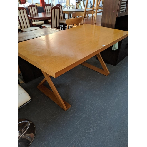 784 - A wooden dining table