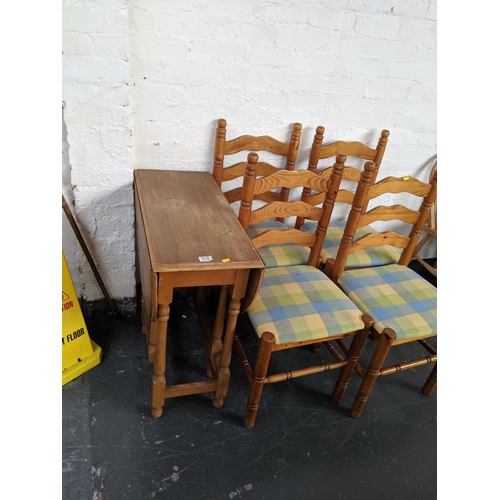519 - A drop leaf dining table and four chairs