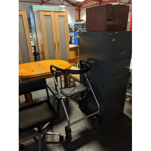 524 - A metal filing cabinet , office chair and a walking aid