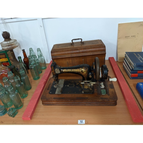 52 - A Frister & Rossman hand crank sewing machine in wooden case