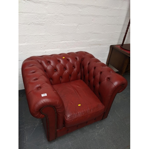 712 - A red leather buttoned back chesterfield armchair