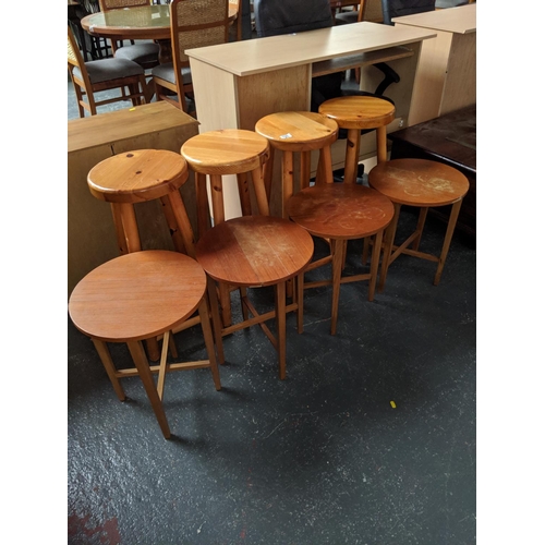 725 - Four pine stools and four fold up tables