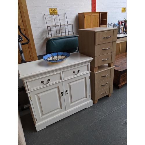 740 - A white two door, two drawer side board, lamp and two bedside cabinets
