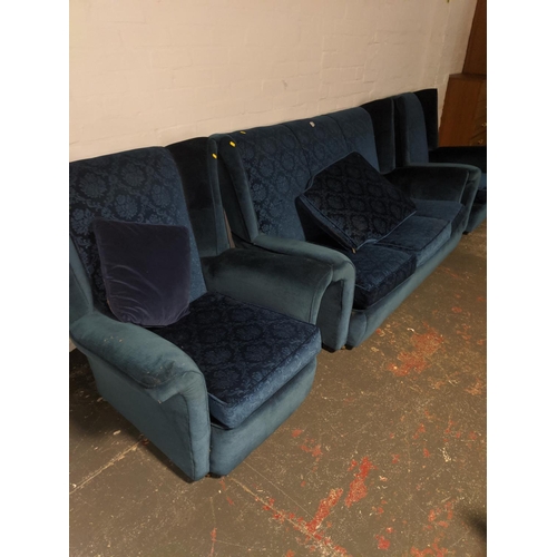 515 - A blue three seater sofa and two matching armchairs