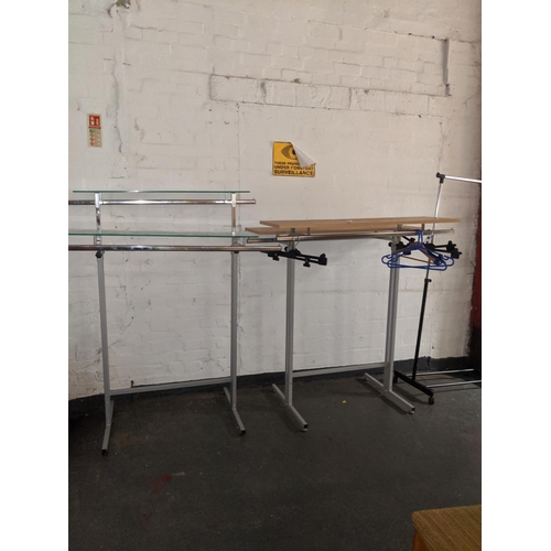 517 - Two shop display clothes rails and a clothes rail