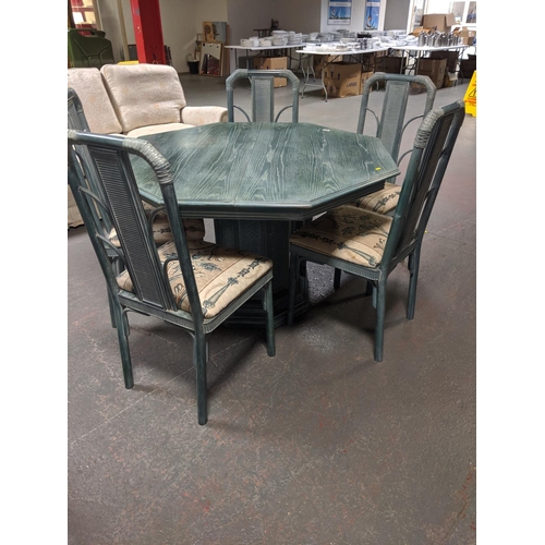 557 - An extending dining table and five chairs