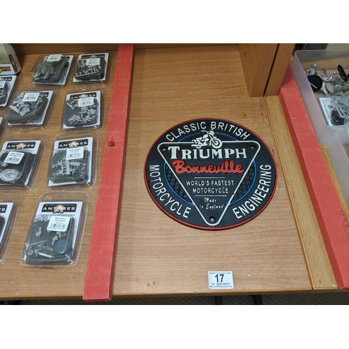 17 - A cast iron Triumph motor cycle plaque