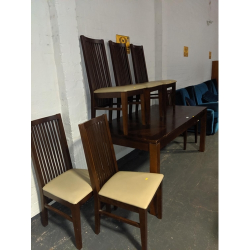 642 - A large dining table and six chairs