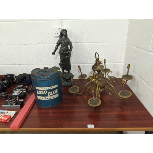 43 - A large spelter figure, brass light and a Esso paraffin can