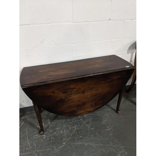 203 - An early drop leaf,gate leg, mahogany dining table