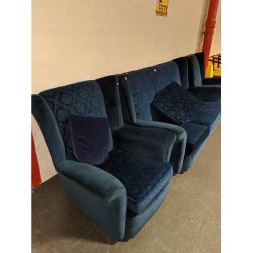 759 - A blue three seater sofa and two matching armchairs