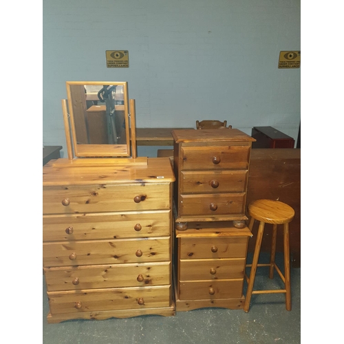 549 - A pine stool, mirror, chest of drawers and two bedside cabinets