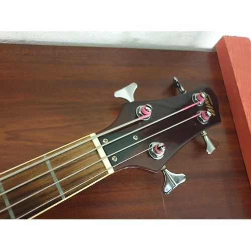 41 - A Swift electro-acoustic fretless base guitar