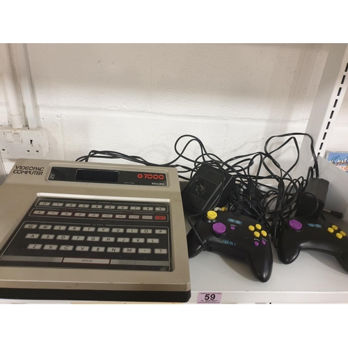 59 - A boxed Prinztronic game, Videopac computer with controllers etc (two shelves)