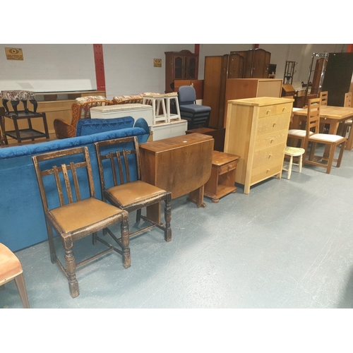 853 - An oak chest of drawers, drop leaf table, pine bedside cabinet etc.
