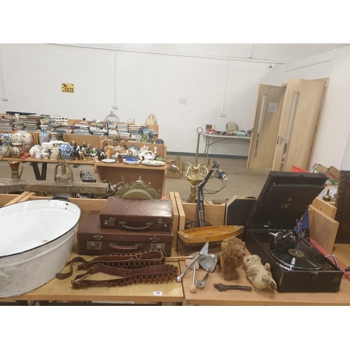 19 - An enamel bath, leather suitcase, wind up gramaphone and vintage items