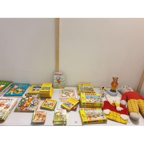 77 - A collection of vintage Rupert the Bear memorabilia to include teddy bear, books, jigsaw puzzles, et... 