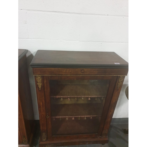 205 - A Victorian mahogany and rosewood pier cabinet with ormolu mounts