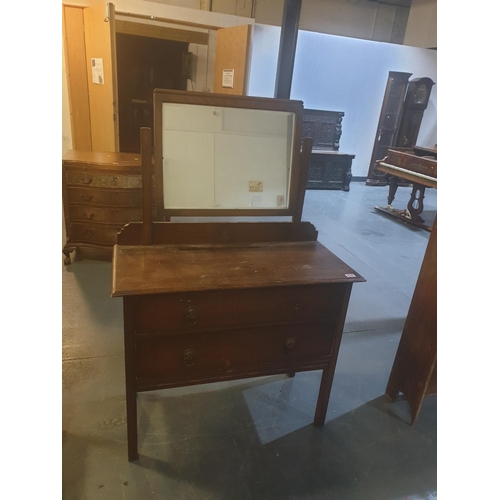 214 - A two drawer, single mirror oak dressing chest