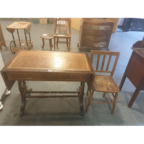 215 - A two drawer desk with leather insert and a farmhouse chair