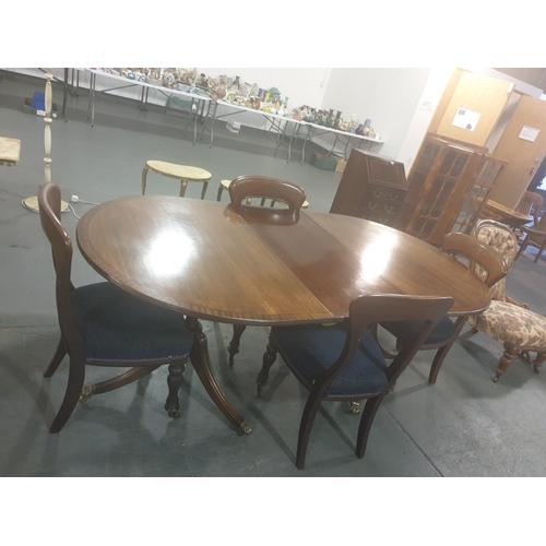 218 - A twin pedestal mahogany Regency style dining table and four Regency chairs