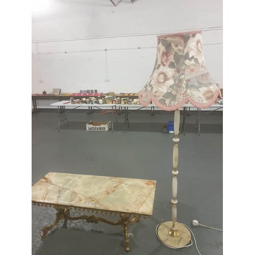 221 - A marble topped coffee table on brass stand and an onyx standard lamp