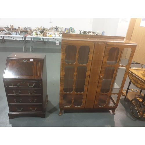 223 - A display cabinet and a writing bureau