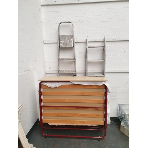 302 - Two aluminium stepladders and a put-me-up guest bed