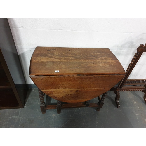 106 - An oak drop leaf dining table