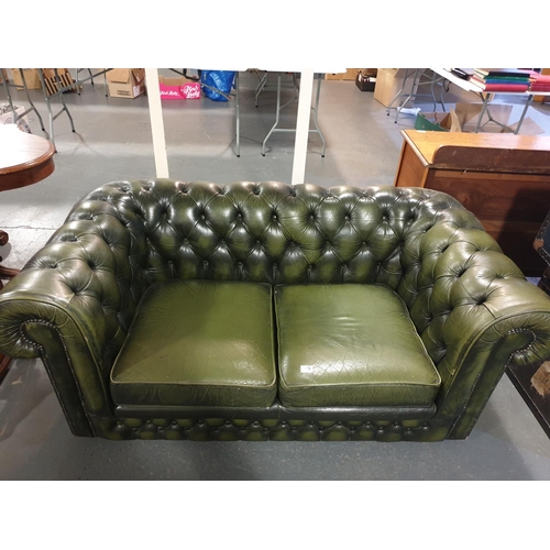 118 - A green leather Chesterfield button backed two seater sofa