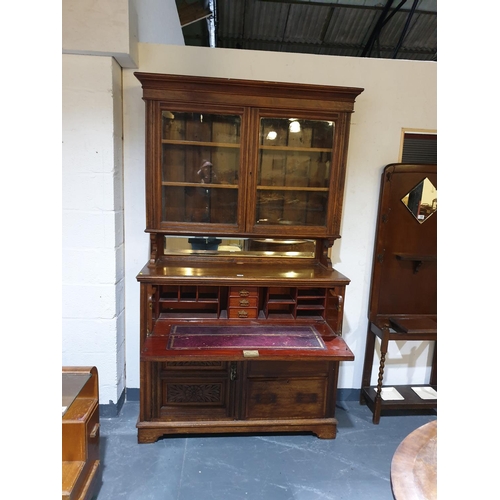 129 - An oak secretaire bookcase