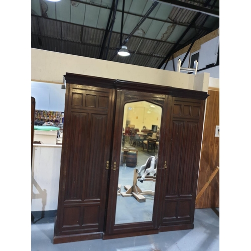 131 - A mahogany compactum - 3 section wardrobe