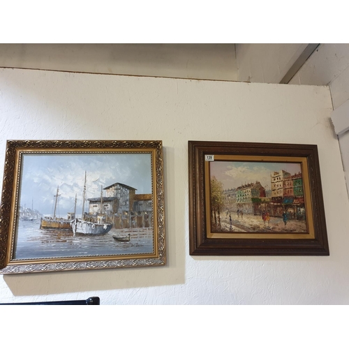 139 - Two framed oils on canvas - fishing boats in harbour and a street scene signed W. Jones