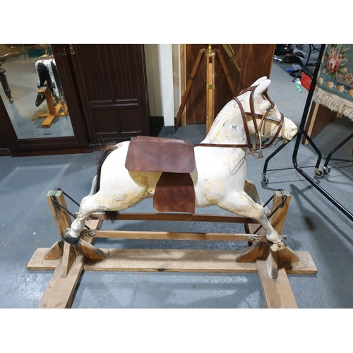 142 - An early rocking horse - partially restored (new saddle, reigns, etc)