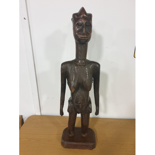 269 - A Nigerian carved wooden scultpture of a female with an infant on her back. This was carved by the T... 