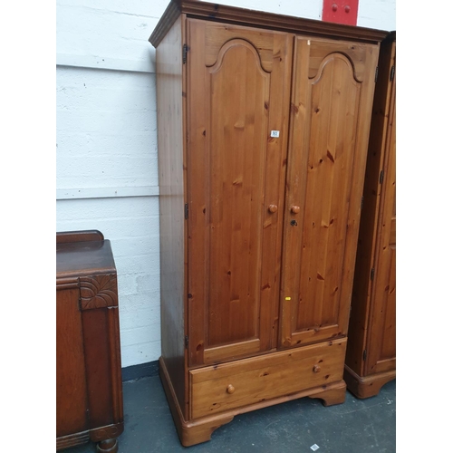 503 - A pine double door wardrobe with drawer
