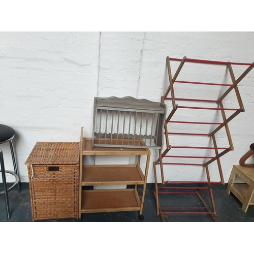 520 - A clothes horse, laundry basket, drinks trolley, etc