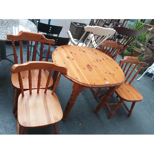 535 - A pine dining table and four chairs