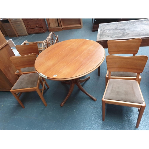 558 - Circular extending dining table and four chairs