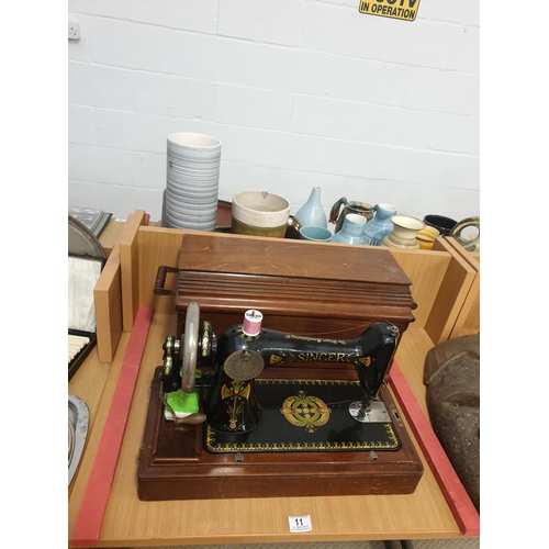 11 - An antique cased Singer sewing machine