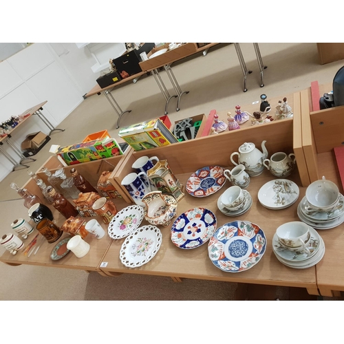 31 - A collection of china and glass including three Imari plates, decanters, Chinese tea set etc