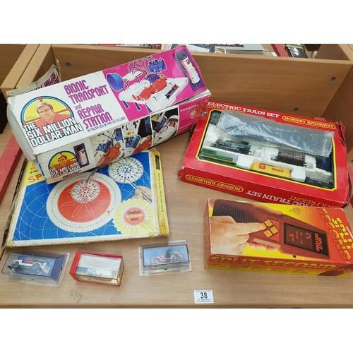 38 - A boxed Hornby electric train set, boxed The Six Million Dollar Man, Spirograph, etc